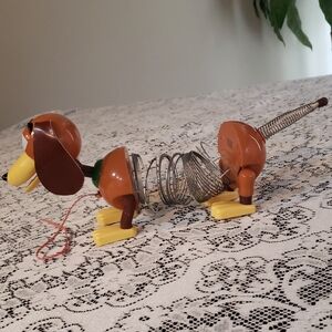 Brown and Yellow Slinky pull Toy From Toy Story Movie.